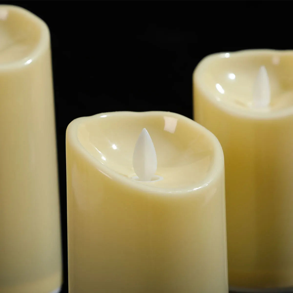 Close detail of the moving LED flame on the flameless pillar candles