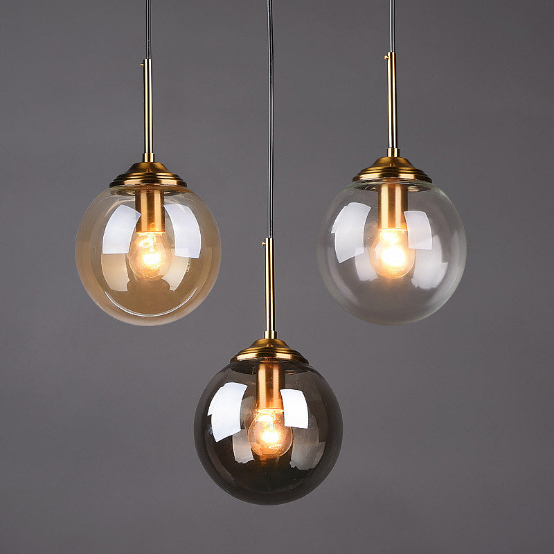 Modern Glass Globe Pendant Light with Brass Accents