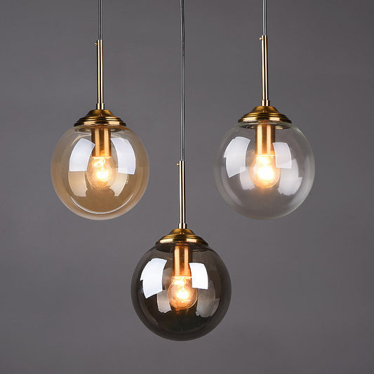 Modern Glass Globe Pendant Light with Brass Accents