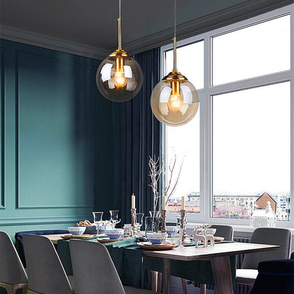 Modern Glass Globe Pendant Light with Brass Accents