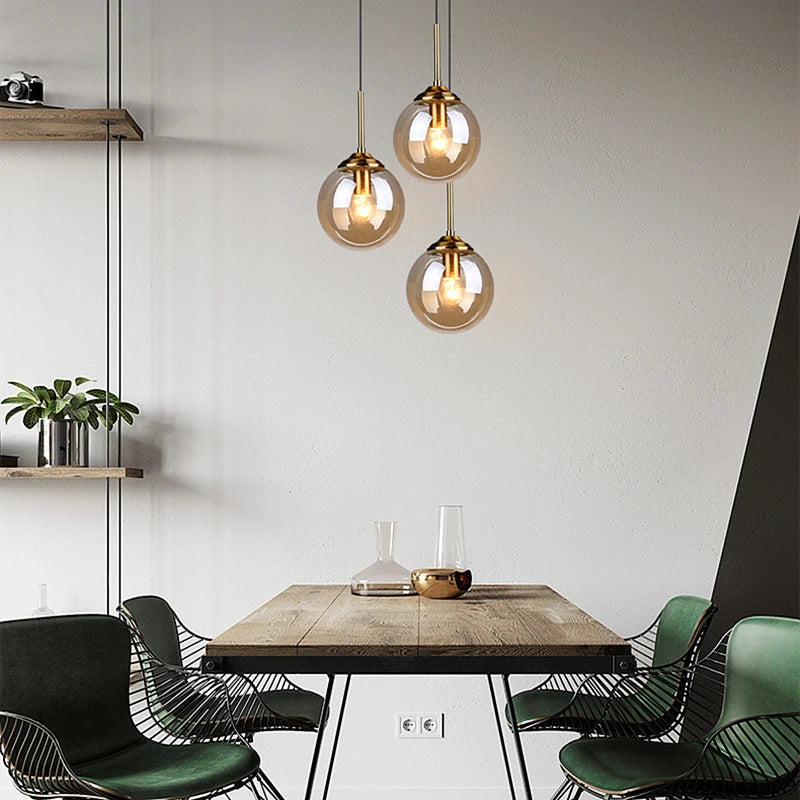 Modern Glass Globe Pendant Light with Brass Accents