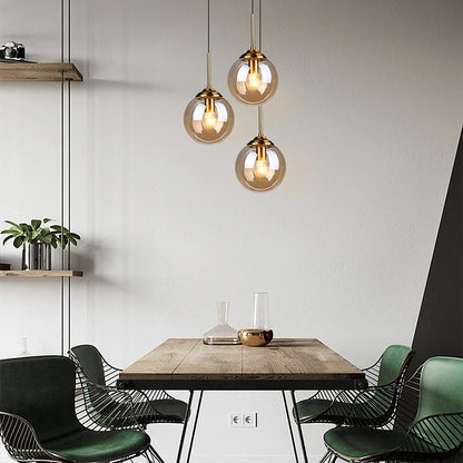 Modern Glass Globe Pendant Light with Brass Accents