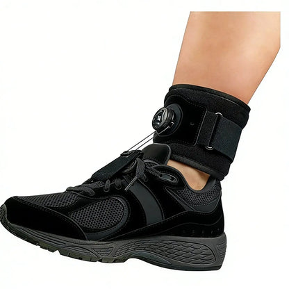 Foot drop brace worn with a sneaker — the dorsiflexion cord gently lifts the toe so you can walk without catching it