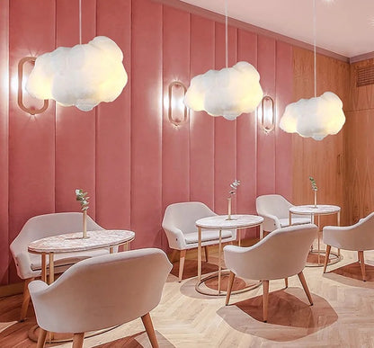 Cloud pendant lamps glowing warm white — real product photo