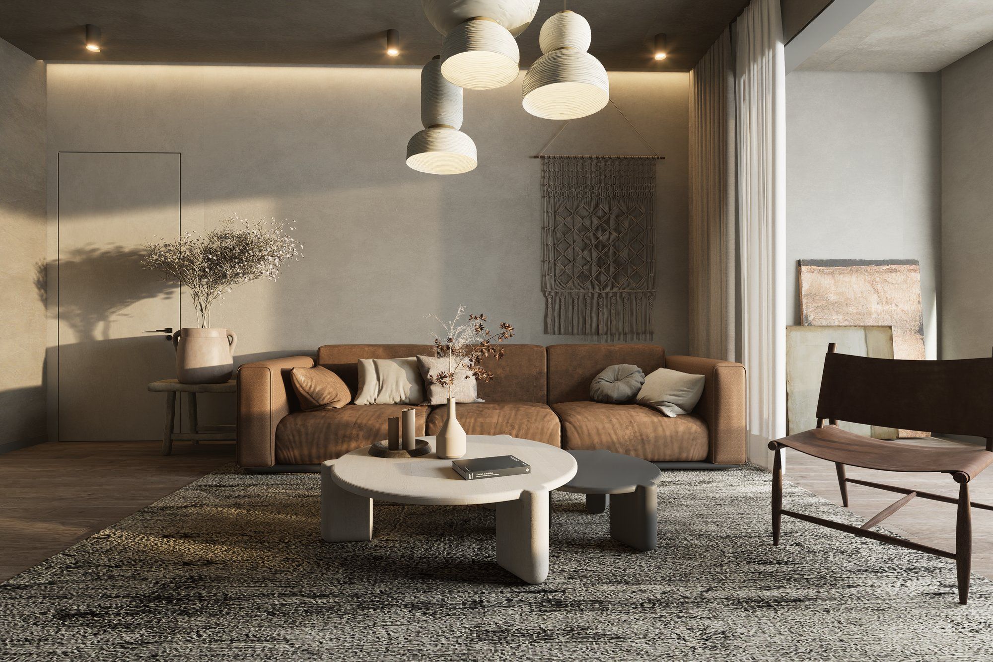 Refined modern living room with sculptural pendant lighting and leather sofa