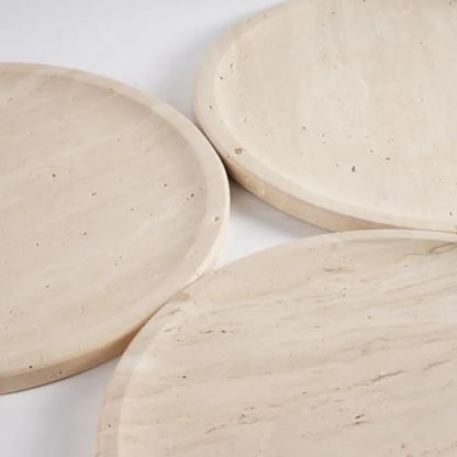 Natural travertine round trays — close detail of the stone texture