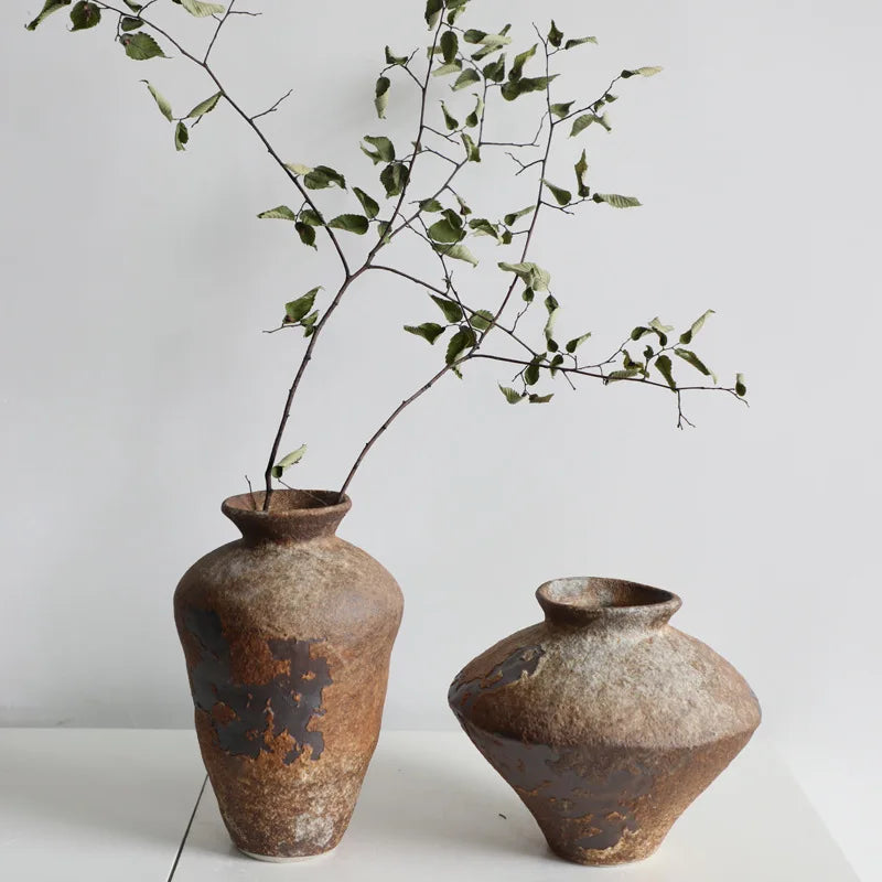 Wabi-Sabi Stoneware Vase — sculptural raw-clay finish on neutral background