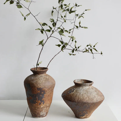 Wabi-Sabi Stoneware Vase — sculptural raw-clay finish on neutral background