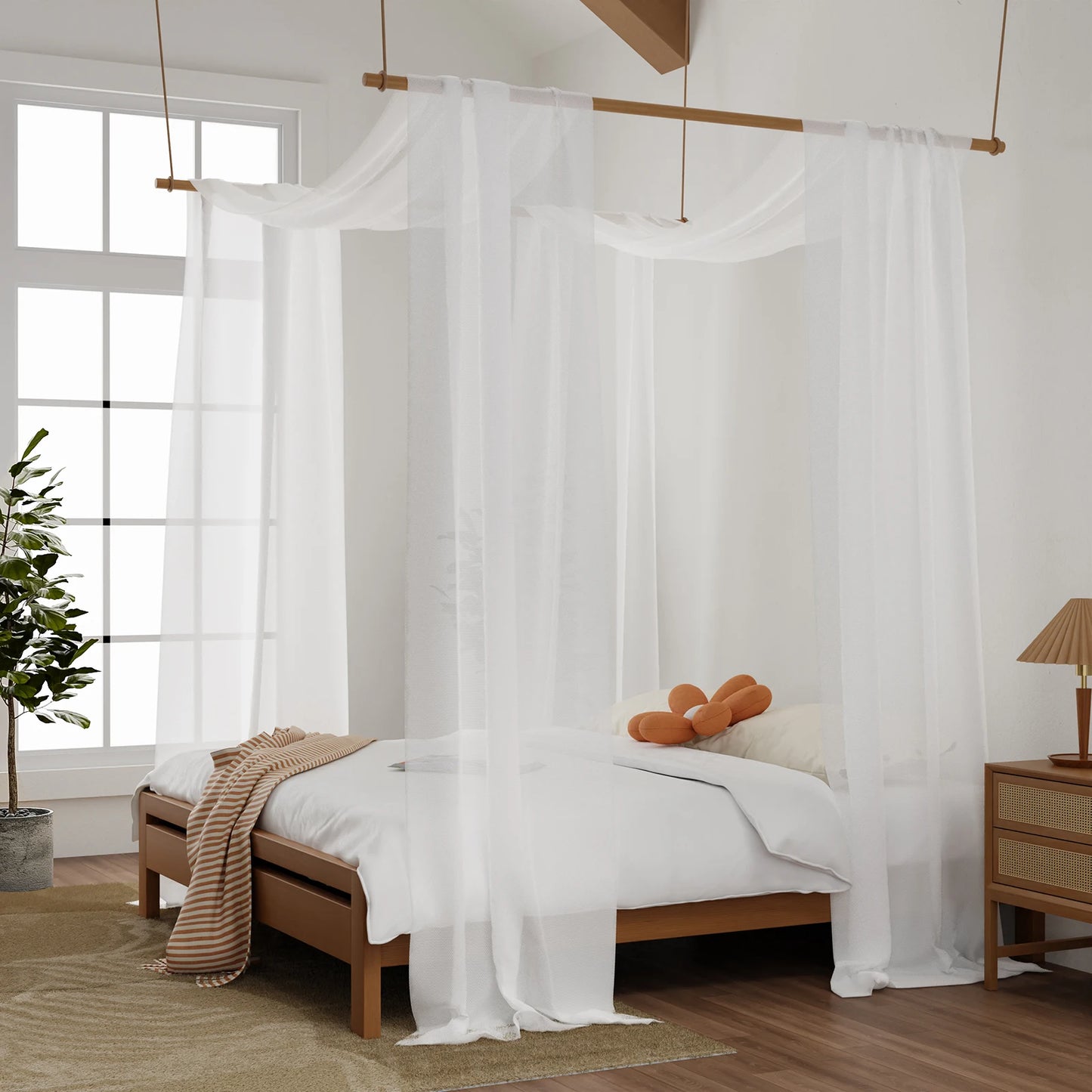 White sheer bed canopy draped over suspended rod above bed